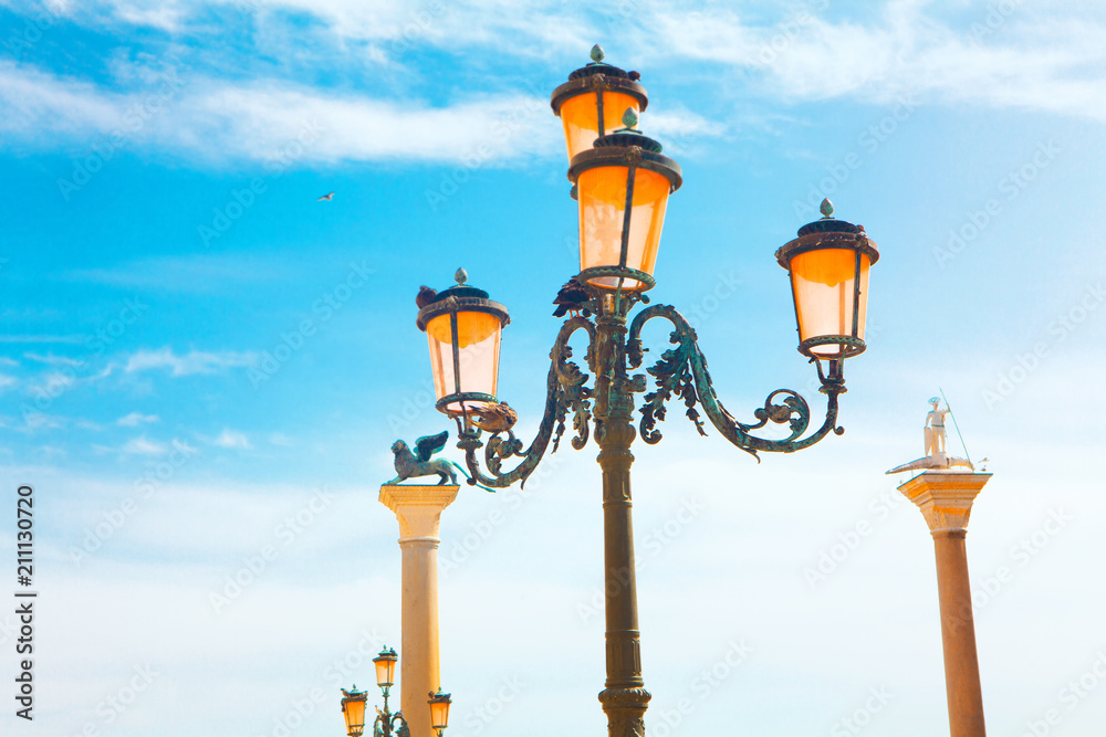 Venice historical streetlight against blue sky 