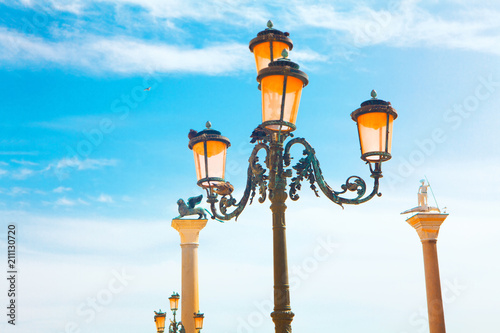 Venice historical streetlight against blue sky 