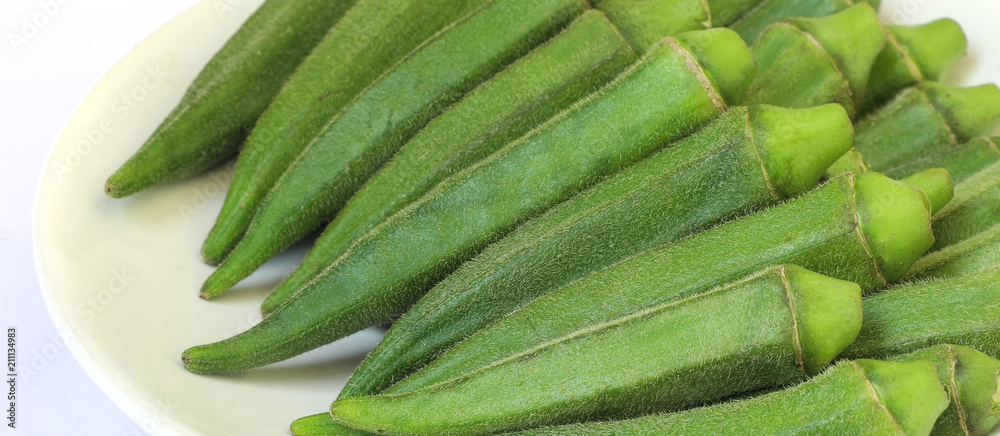 Fototapeta premium baby okra in a white place
