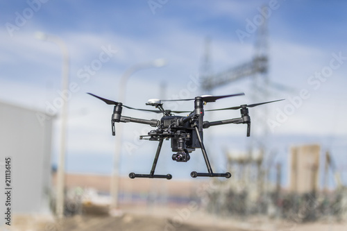 Fototapeta Naklejka Na Ścianę i Meble -  Drone inspections for Solar Energy and High Voltage Lines. Operator and screen review