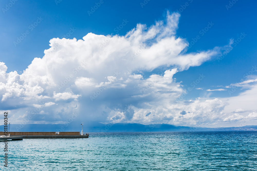 Pierce for boats in Croatia city with clouds in background