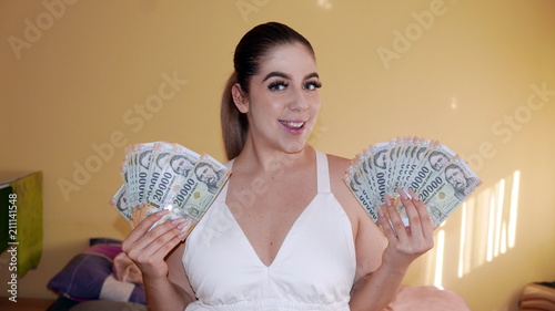 Winner girl - smiling face with lot of money