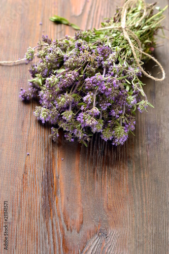 Organic fresh thyme on a wooden table
