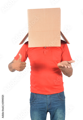 Young man gesturing with a cardboard box on his head isolated on white background © flowgics