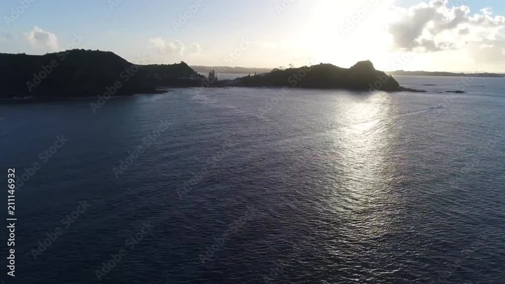 Wonderful 4k aerial drone view on big forest mountain tropical island in middle of deep blue calm ocean water seascape Wonderful 4k aerial drone view on big forest mountain tropical island in middle of deep blue calm ocean water seascape