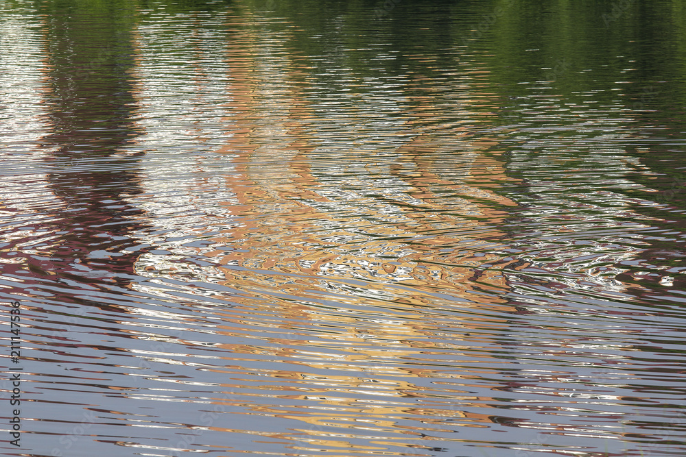 Reflection of the brick building on the shores of lake Reflection of the brick building on the shores of lake