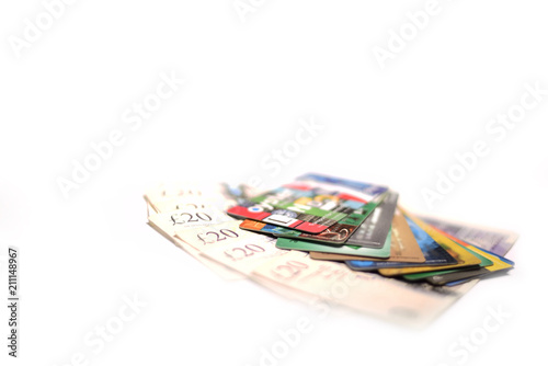 British pound, oyster card and credit card on white background photo