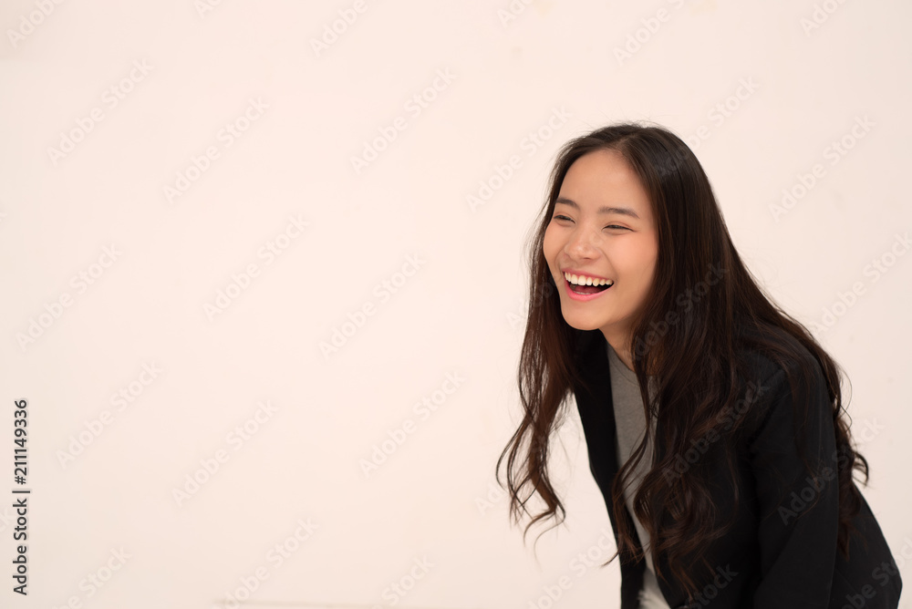 Beautiful young women are smiling happily on a simple background and leave space for text input. Beautiful young women are smiling happily on a simple background and leave space for text input.