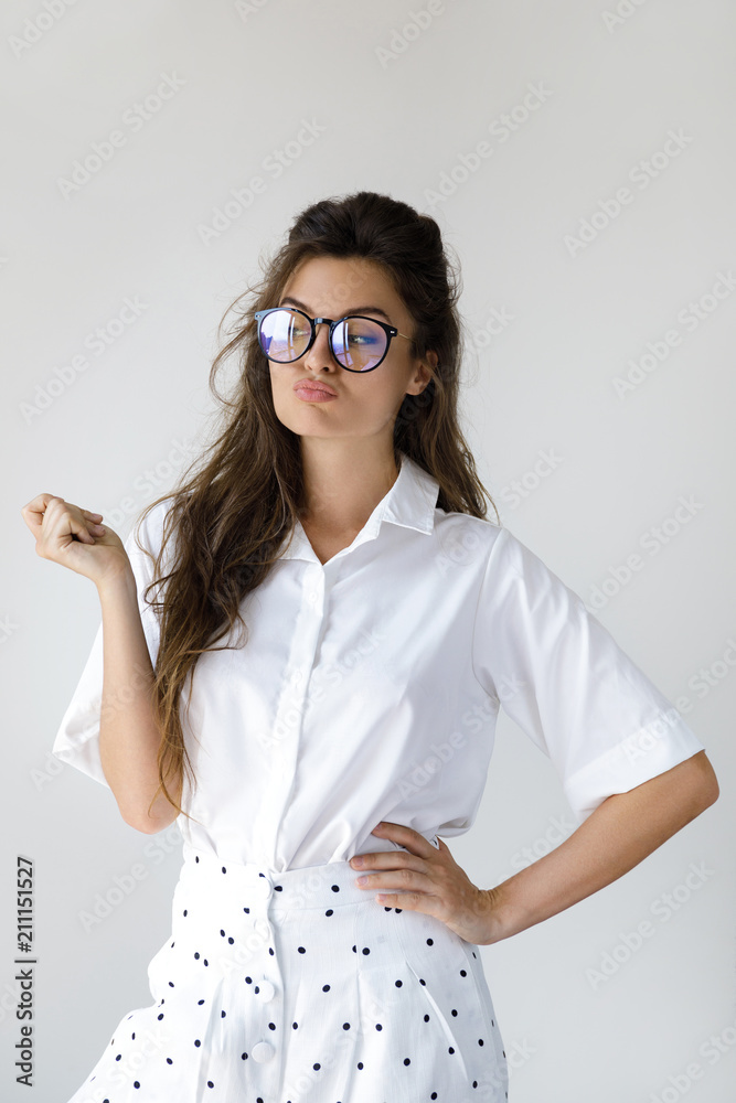Young businesswoman wearing stylish clothes and eyeglasses Young businesswoman wearing stylish clothes and eyeglasses