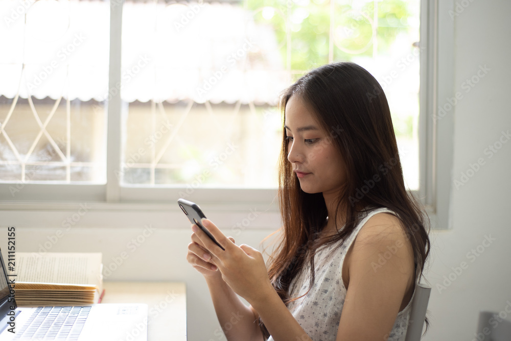 Pretty woman happy and smile for shoping online with her mobile Pretty woman happy and smile for shoping online with her mobile