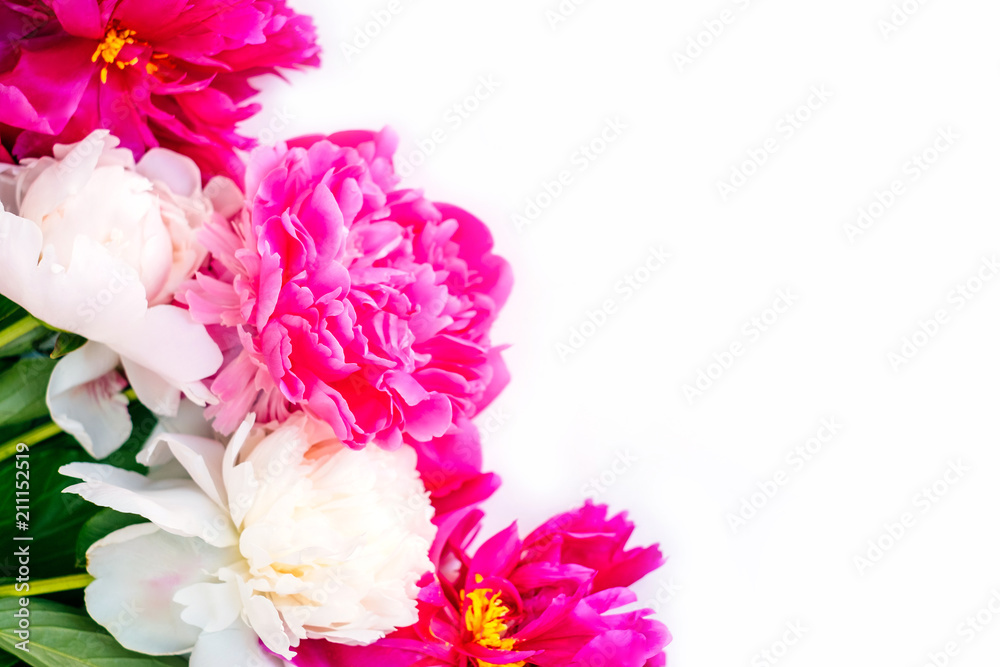 Frame of beautiful fuchsia and white peony flower bouquet on the white background. Closeup, flatlay style.