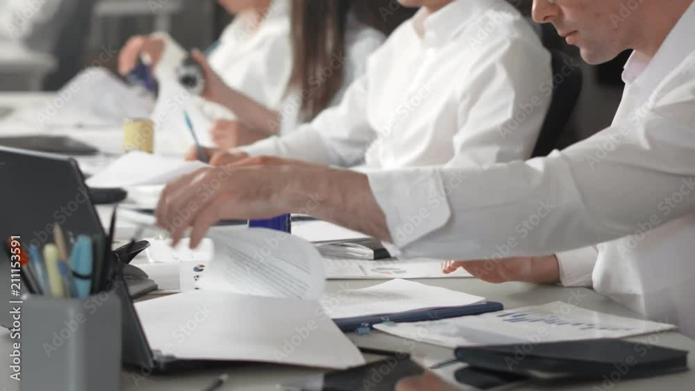 Sales team is formal dress work with papers Sales team is formal dress work with papers
