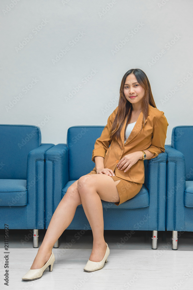 Portrait of beautiful asian business woman wear yellow dress in a office,Thailand people wear ladies uniforms office,Sexy woman on sofa Portrait of beautiful asian business woman wear yellow dress in a office,Thailand people wear ladies uniforms office,Sexy woman on sofa