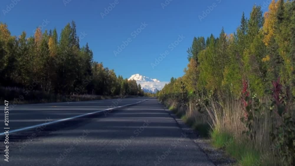 Zoom In From Road to Mt. McKinley as Bus Passes Zoom In From Road to Mt. McKinley as Bus Passes