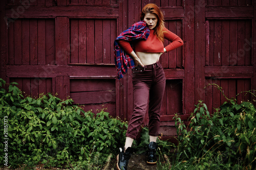 Fashion portrait of redhaired sexy girl outdoor. Model attractive seduction woman.