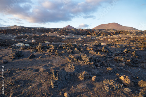 Lava rocks spreaded in black sand with moonlandscape, El Restinga, El Hierro, Canary Islands, Spain photo