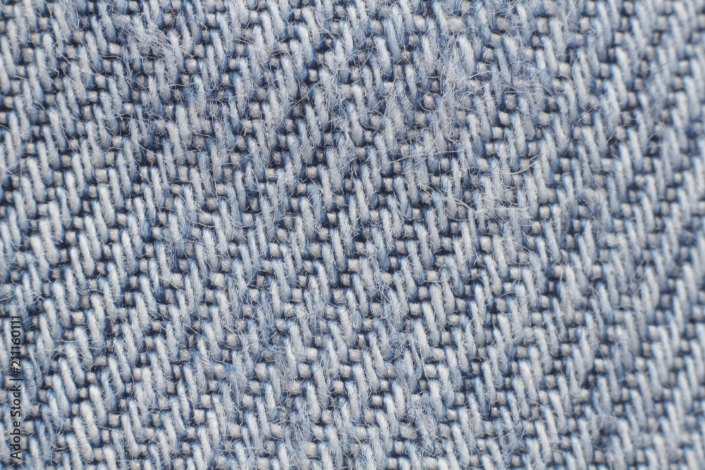 Texture of blue jeans as a background, macro mode Texture of blue jeans as a background, macro mode