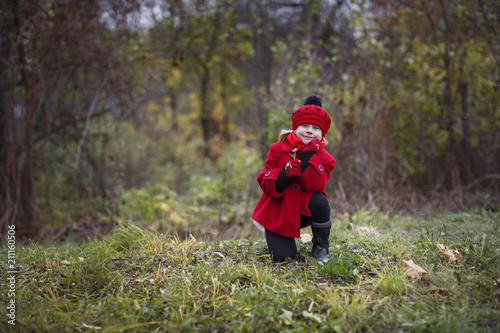little girl in red coat and in a red hat