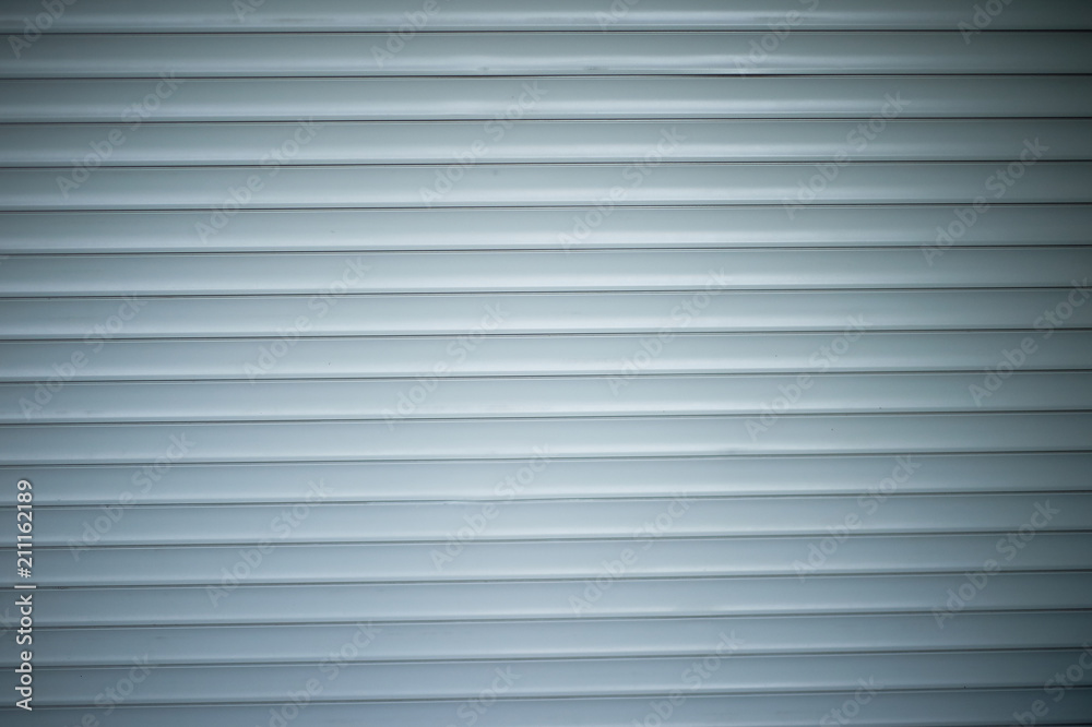 The texture of the roller shutter is grey. Closely The texture of the roller shutter is grey. Closely