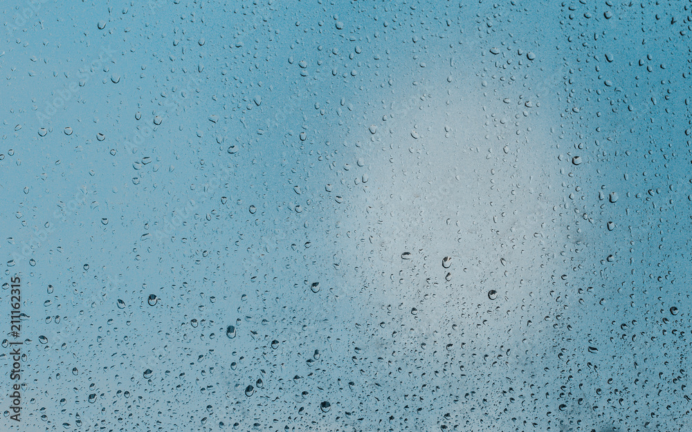 Beautiful colors on the glass soaked in the morning rains. You can see leaking drops on the glass.