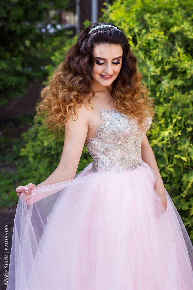 Fototapeta premium Girl in pink wedding dress