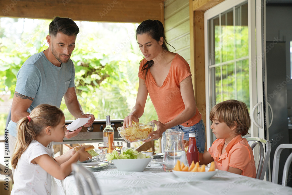 Family on vacation having outdoor lunch Family on vacation having outdoor lunch