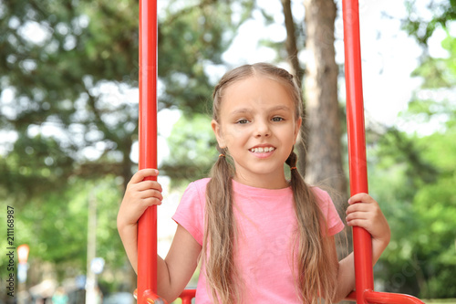 Cute little girl playing on...