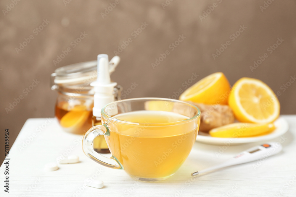 Cup with hot tea for cold on table Cup with hot tea for cold on table