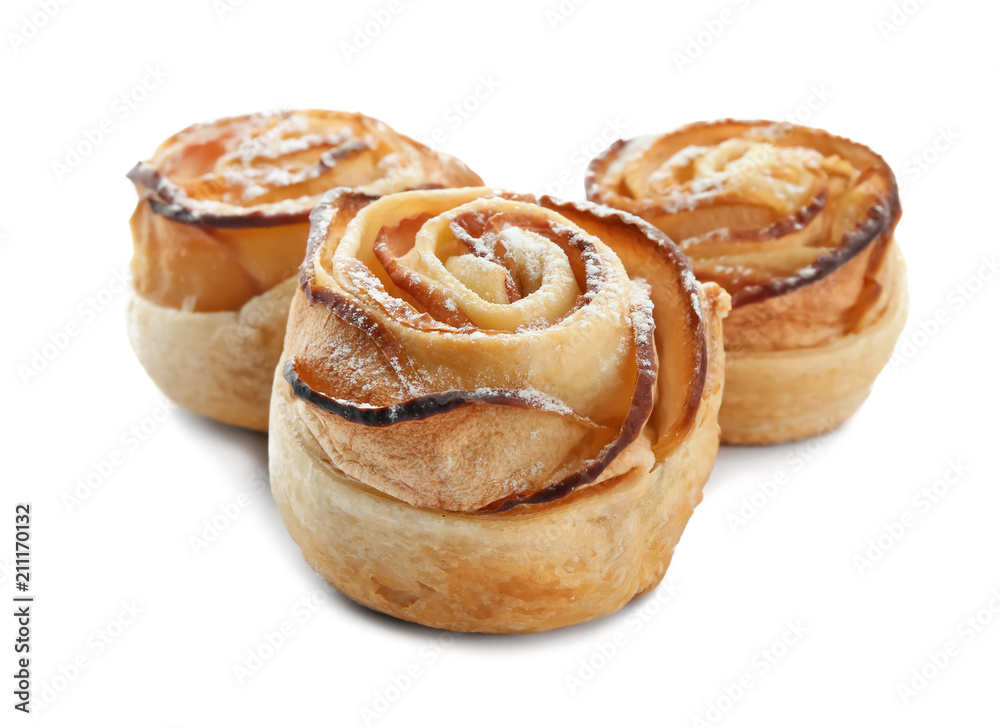 Fototapeta premium Tasty apple roses from puff pastry on white background