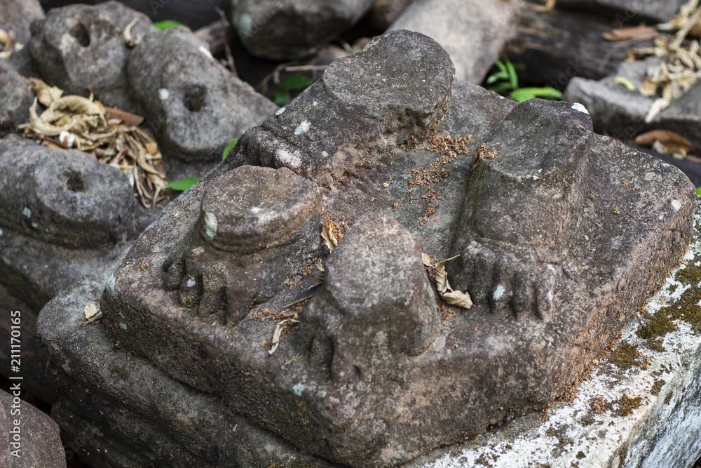 Ancient stone ruin in Angkor Wat temple. Animal paw statue debris closeup. Khmer heritage temple ruin in jungle. Ancient stone ruin in Angkor Wat temple. Animal paw statue debris closeup. Khmer heritage temple ruin in jungle.