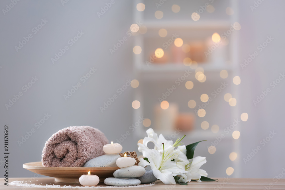 Beautiful spa composition on table in wellness center - obrazy, fototapety, plakaty 