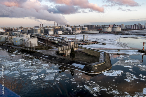 Exit from the sea port to St. Petersburg from the deck of the ferry at sunset photo