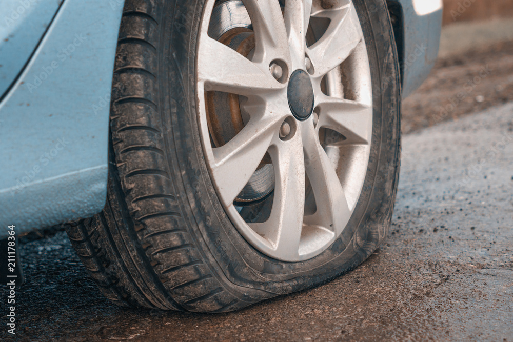 Flat rear tire on a car