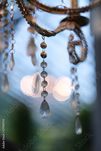 Decorative pendant made of crystal beads and metal rings on a stylized antique chandelier © Anna Jurkovska