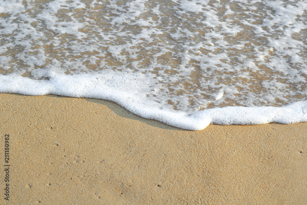 Soft wave of blue ocean on sandy beach. Background. Soft wave of blue ocean on sandy beach. Background.