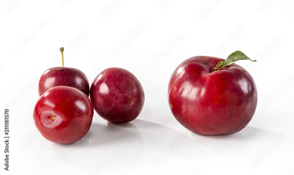 Cherries and red plum over white background Cherries and red plum over white background