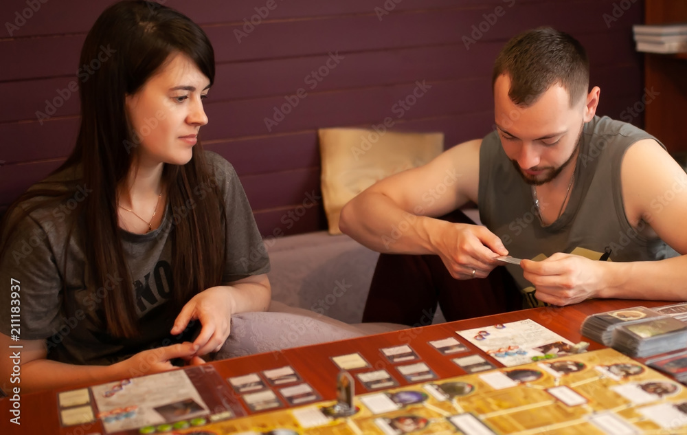 Moskow, 12 june 2018. Couple playing board game at home