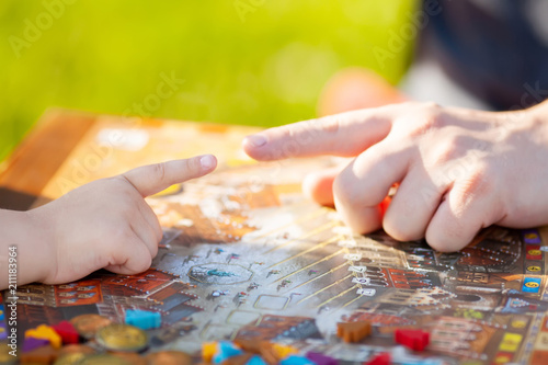 Moscow  june 18 2018. Father and his cute little girl playing strategy board game