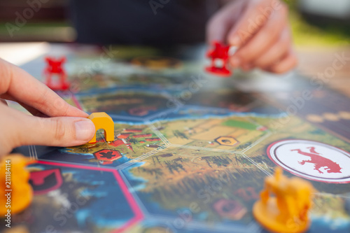 Moscow june 18 2018. Two players playing wargame: robots and heroes miniatures at the board game field