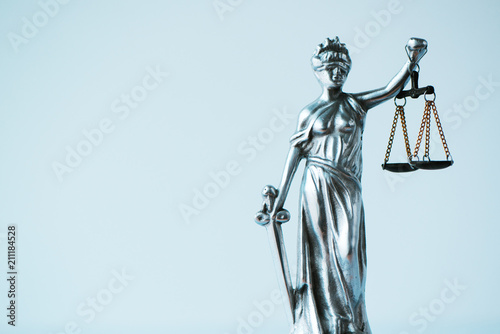 Lady Justice statue in law firm office photo