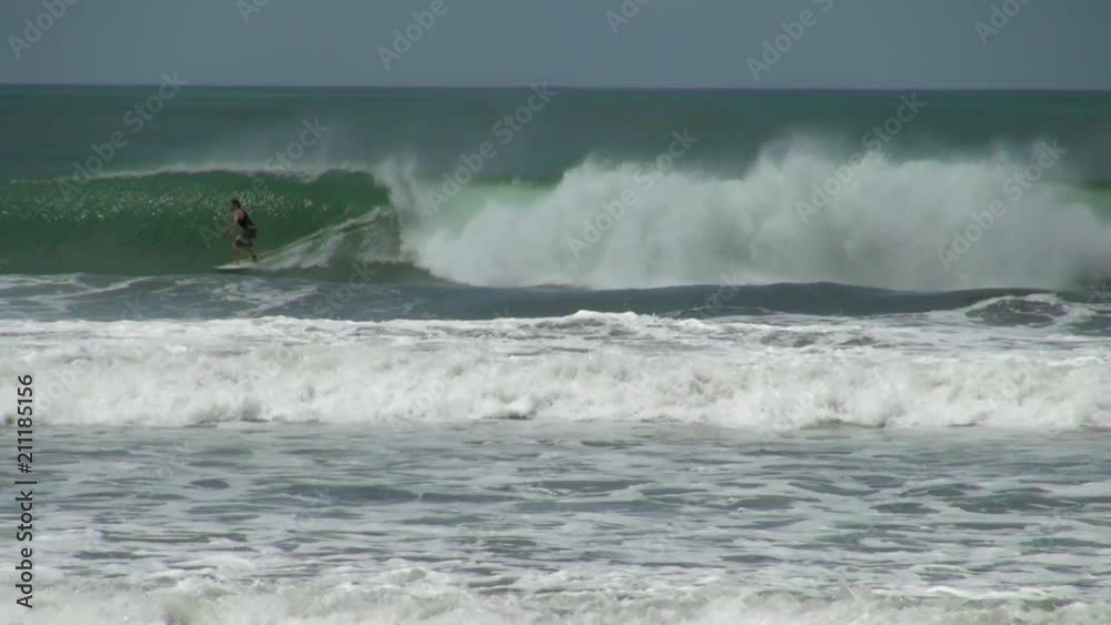 Slow Motion Shot of Panama Surfer Riding Waves Slow Motion Shot of Panama Surfer Riding Waves