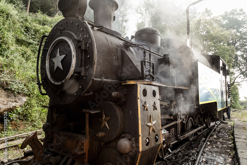 Old steam locomotive train and smoke, Nilgiri Mountain Railway, Ooty, Tamil Nadu, India