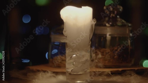 Cocktail with dry ice, evaporating white thick smoke