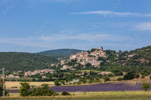 Lavender fields and a hilltop town in Provence, France photo