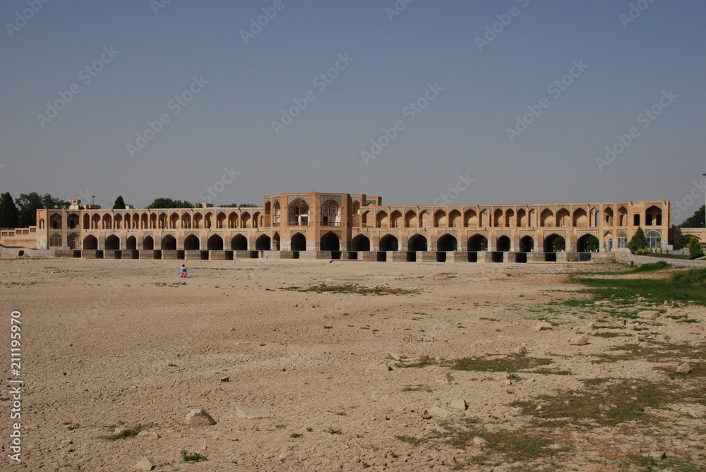 Historic Khaju Bridge in Isfahan fraturing numerous pointed arches