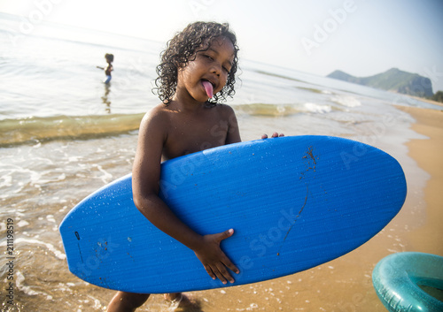 Canvas Print African little boy playing at the beach