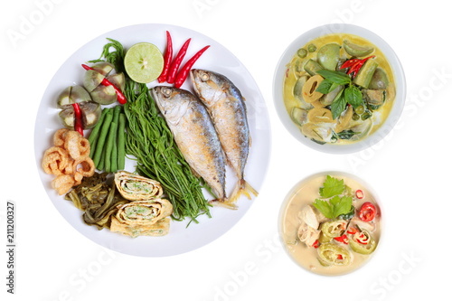 Coconut milk and fermented soy bean sauce and green curry with side dish as deep fired mackarels,omelet,crispy pork rind,halve green lemon,red chili and boiled of eggplant

