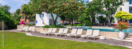 Panorama sunbathing lounger swimming pool side./ panorama sunbathing lounger swimming pool side and flower pot on summer. 