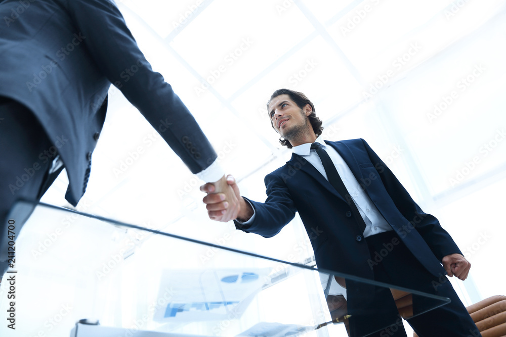 confident business people shaking hands confident business people shaking hands