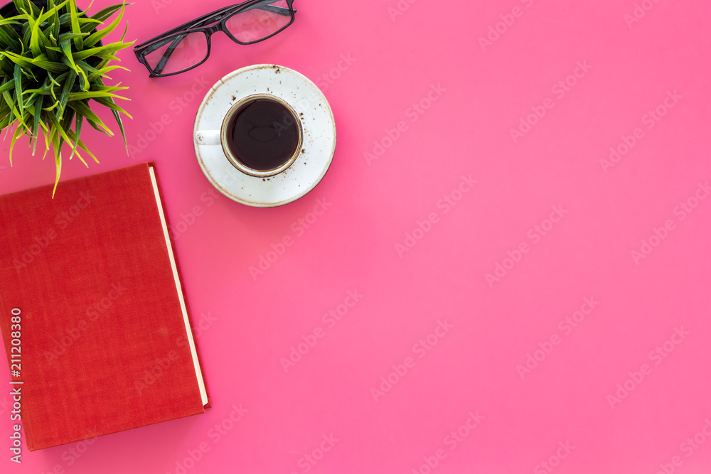 Reading for study and work. Self-education concept. business literature. Books with empty cover near glasses, coffe, plant on pink desk top view copy space Reading for study and work. Self-education concept. business literature. Books with empty cover near glasses, coffe, plant on pink desk top view copy space